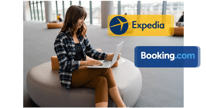 happy-woman-using-lap-top-while-sitting-airport-lounge-01-min